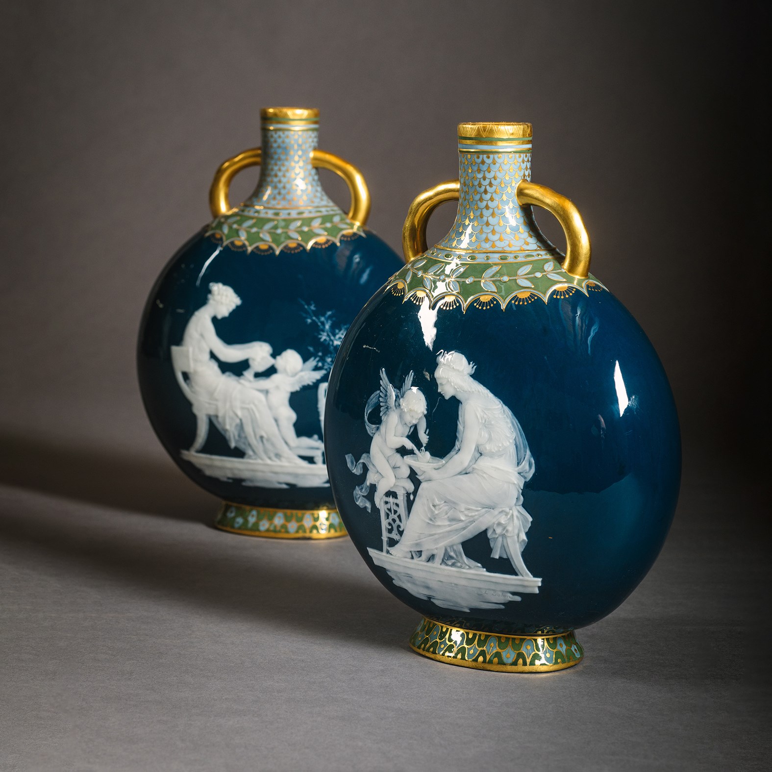 A Pair of Mintons Pâte-sur-pâte Peacock Blue Moon Flasks