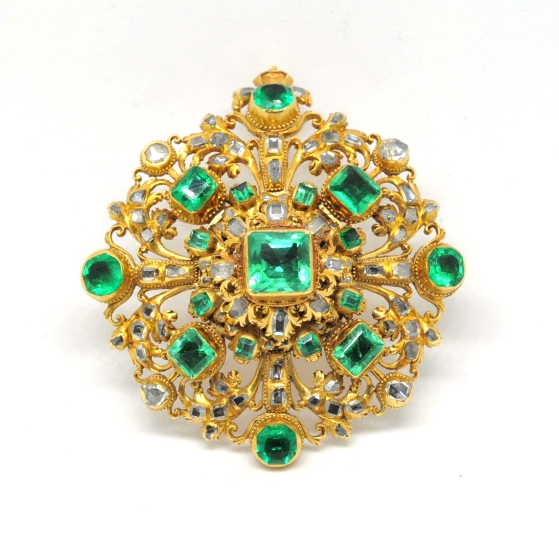 An emerald and diamond pendant